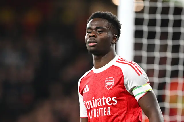 Bukayo Saka of Arsenal looks on