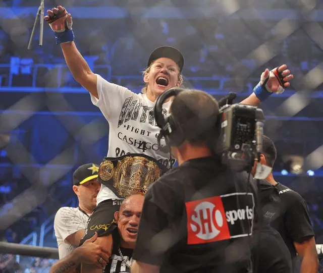 Cris Cyborg with her Strikeforce belt