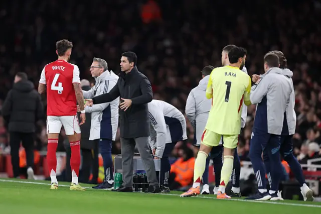 Mikel Arteta, Manager of Arsenal, talks with Ben White