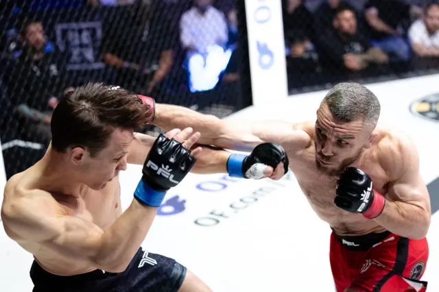 Tuomas Grönvall is punched by Dean Garnett