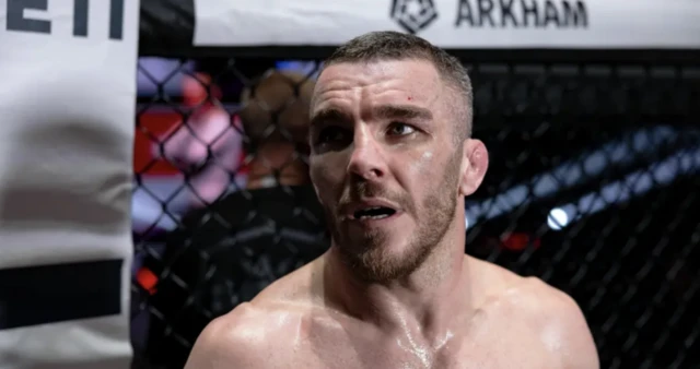 Dean Garnett looking on in the cage