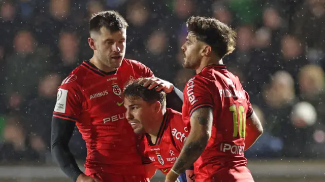 ...and then celebrates with Blair Kinghorn and Romain Ntamack