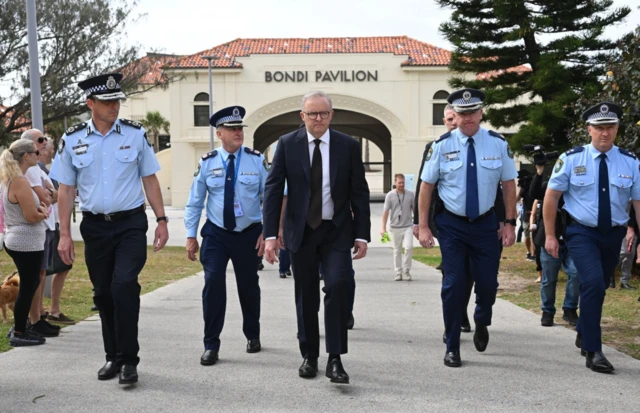 Australian Prime Minister Anthony Albanese visits the scene where he laid flowers