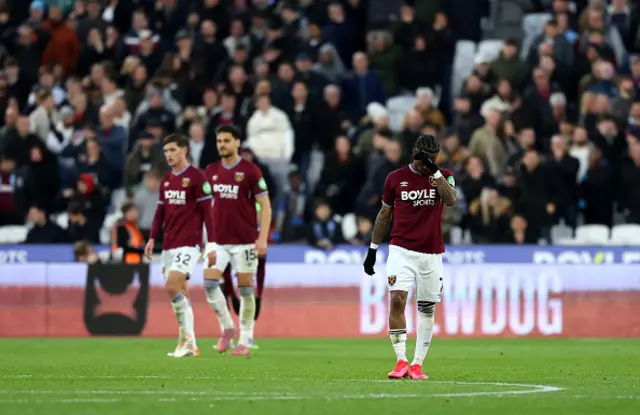 Crysencio Summerville of West Ham United and teammates appear dejected