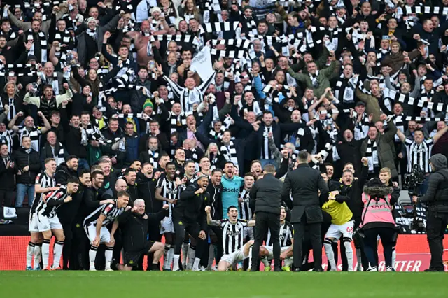 Newcastle United fans celebrate with the players