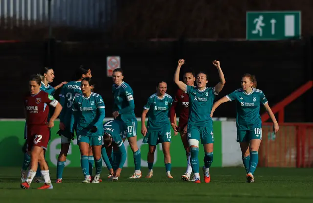Beata Olsson of Liverpool celebrates her team's second goal scored by teammate Mia Enderby