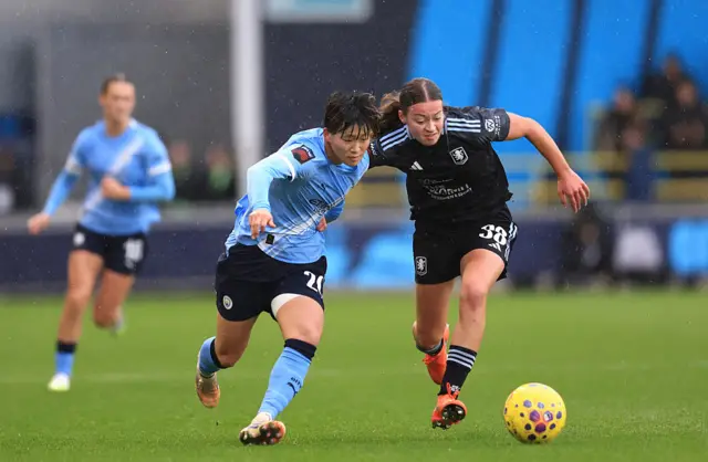 Aoba Fujino of Manchester City and Rachel Maltby of Aston Villa battle for possession