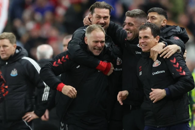 Sunderland manager Regis Le Bris and coaching staff celebrate after the match
