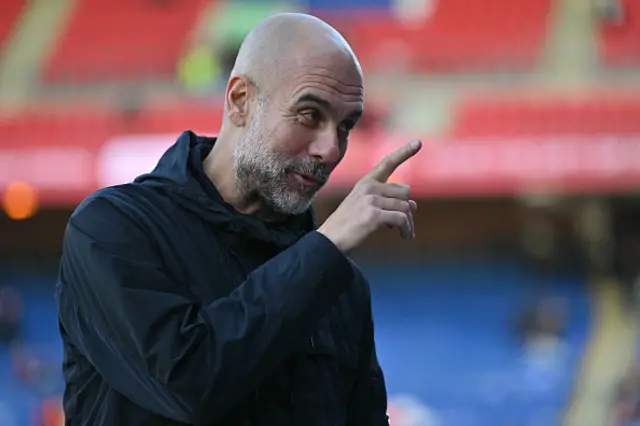Manchester City's Spanish manager Pep Guardiola on the pitch