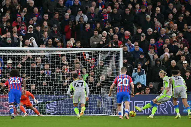 Erling Haaland (2R) scores their third goal from the penalty spot