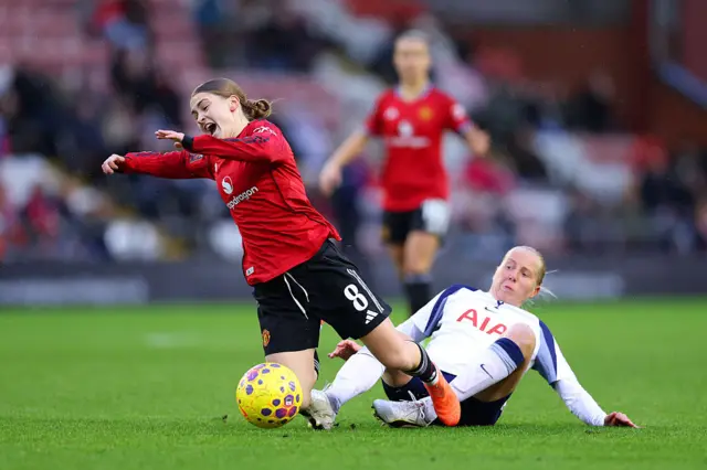 Eveliina Summanen of Tottenham Hotspur tackles Jess Park of Manchester United