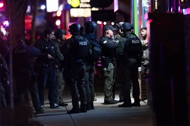Police swarmed outside a bodega in Providence
