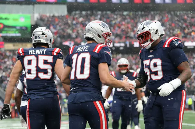 Drake Maye celebrates with New England Patriots teammates
