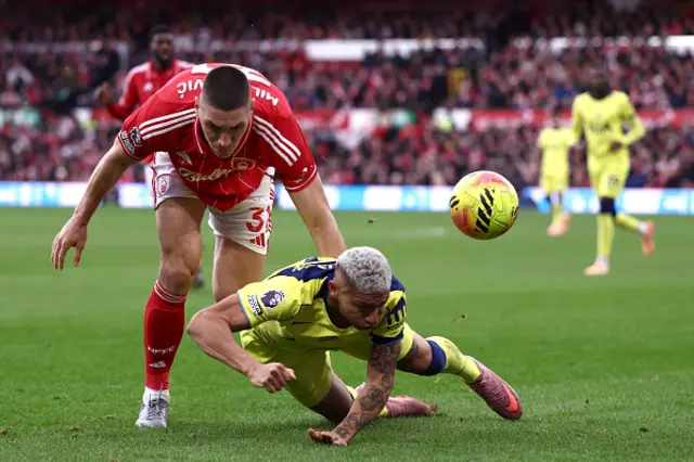 Nikola Milenkovic of Nottingham Forest battles for possession with Richarlison