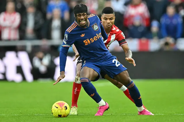 Reinildo Mandava (R) challenges Newcastle United's English midfielder Anthony Elanga