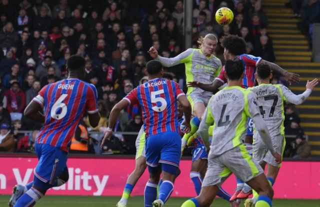Manchester City's Erling Haaland (fifth from left) scores