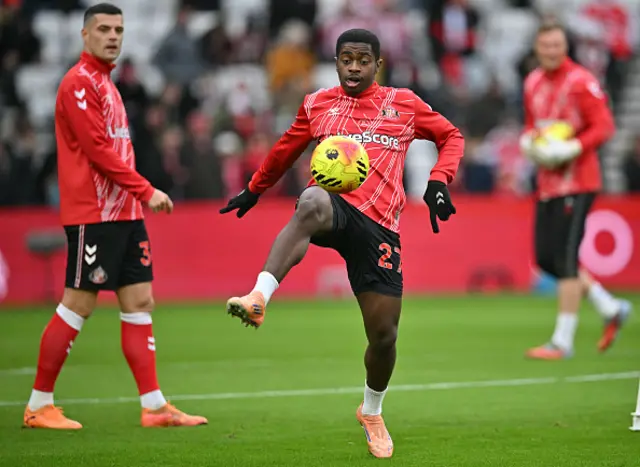 Granit Xhaka (L) and Sunderland's Congolese midfielder Noah Sadiki warms up