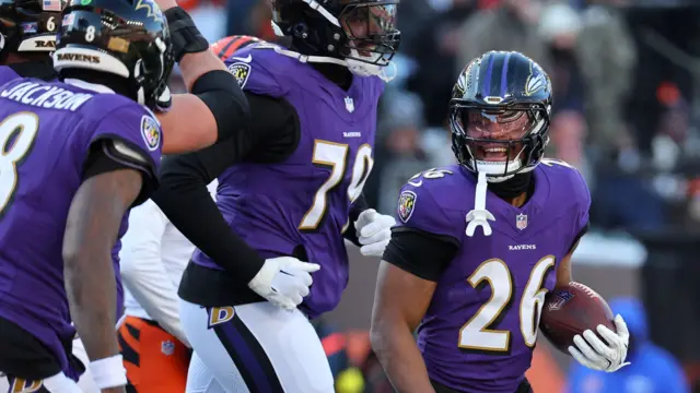 Rasheen Ali smiles after scoring a touchdown for the Baltimore Ravens against the Cincinnati Bengals