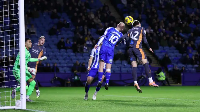 Barry Bannan heads away