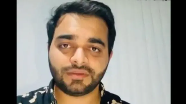A headshot of Naveed Akram
