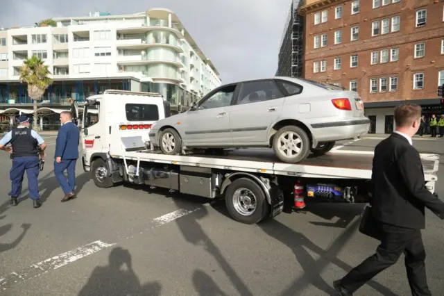A silver car taken away from the scene at Bondi Beach early on Monday on the back of a two truck