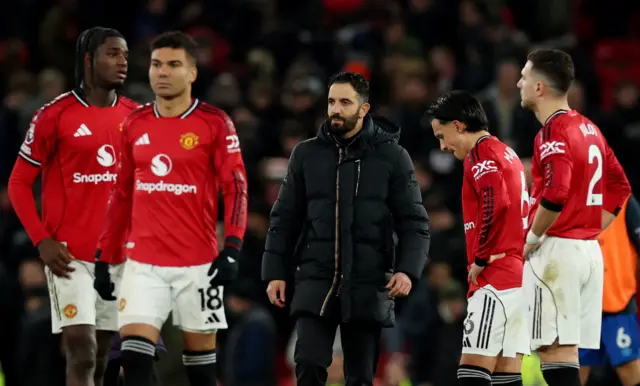 Manchester United manager Ruben Amorim, Manchester United's Ayden Heaven, Manchester United's Casemiro, Manchester United's Lisandro Martinez and Manchester United's Diogo Dalot react after the match