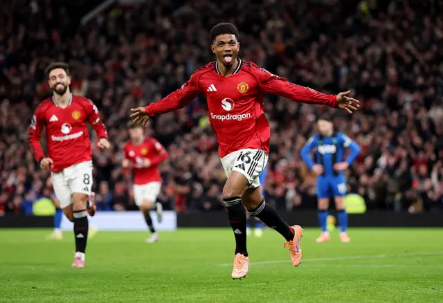 Amad Diallo of Manchester United celebrates scoring his team's first goal