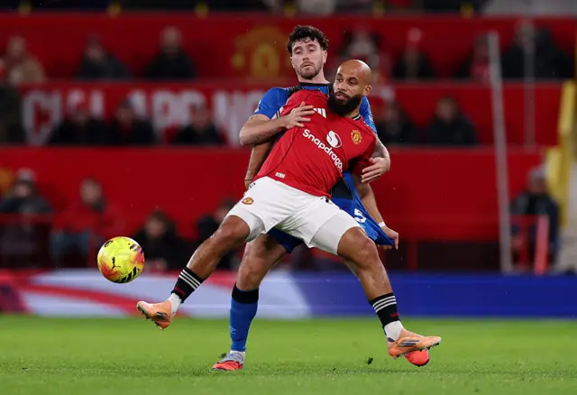 Bryan Mbeumo of Manchester United is challenged by Marcos Senesi of AFC Bournemouth