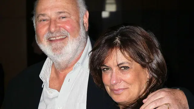 Rob (left) and Michele Reiner. Rob has his arm around Michele and both are smiling.