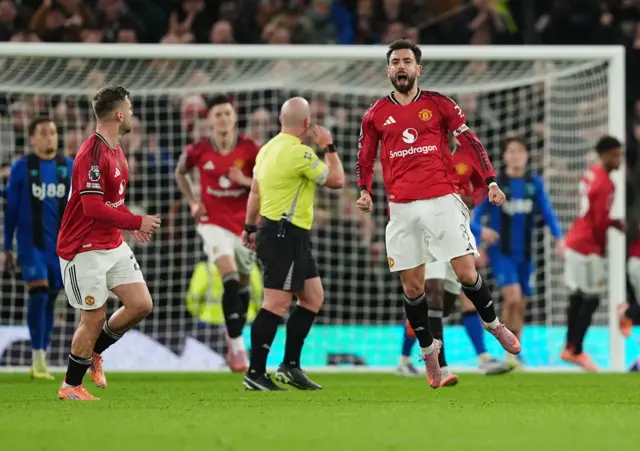 Manchester United's Bruno Fernandes celebrates scoring their side's third goal of the game