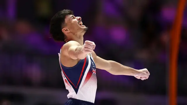 Great Britain's Jake Jarman celebrates winning world gold