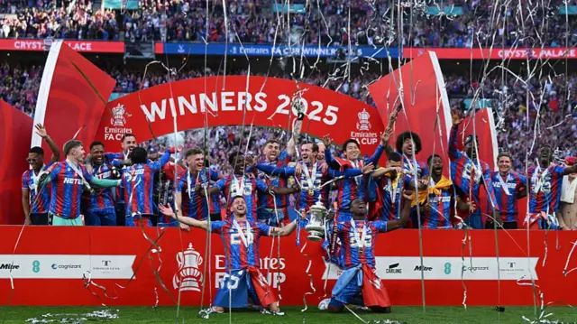 Crystal Palace players celebrate with the FA Cup
