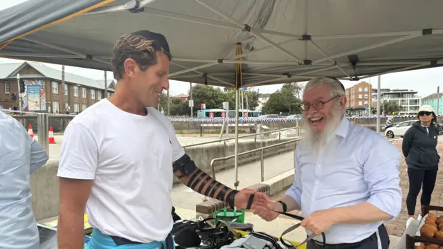 Bondi Rescue lifeguard Anthony Harries-Carroll (left) and Rabbi Yitzchok Barber (right)