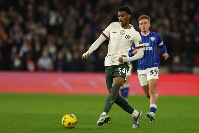 Josh-Kofi Acheampong passes the ball during the English League Cup quarter-final football match between Cardiff City and Chelsea at Cardiff City Stadium.