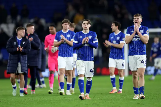 Cian Ashford and Dylan Lawlor of Cardiff City show their appreciation to the fans following the team's defeat in the Carabao Cup Quarter Final match between Cardiff City and Chelsea at Cardiff City Stadium on December 16, 2025.