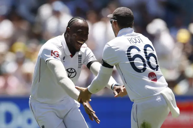Jofra Archer celebrates a wicket with Joe Root