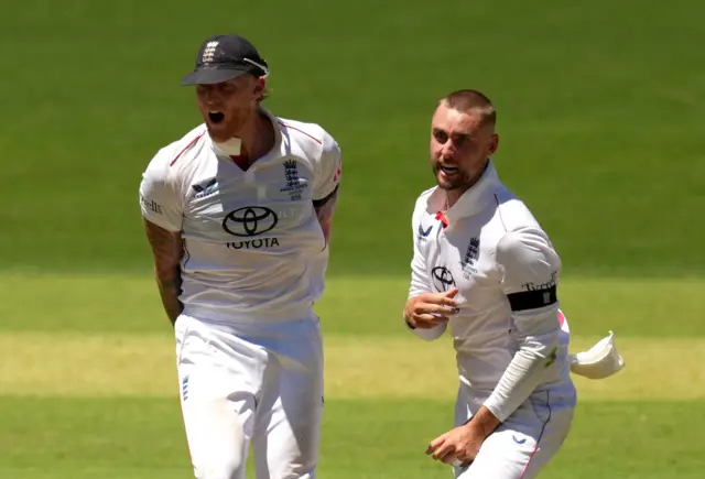 England's Ben Stokes and Will Jacks celebrate after taking the wicket of Australia's Usman Khawaja