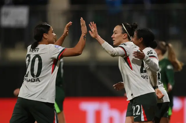 Lucy Bronze of Chelsea celebrates with teammate Sam Kerr