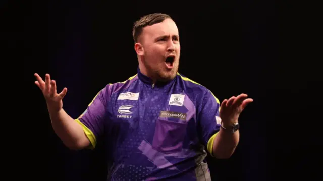 Luke Littler celebrates
