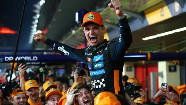 Lando Norris celebrates his world title