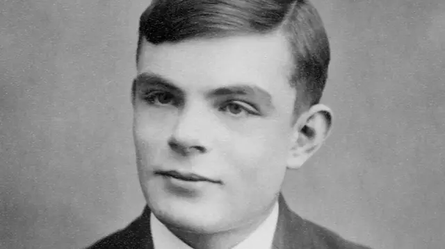 A black and white photo of a young Alan Turing
