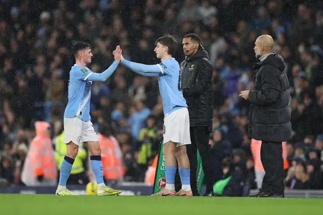 Charlie Gray of Manchester City is substituted on for Phil Foden