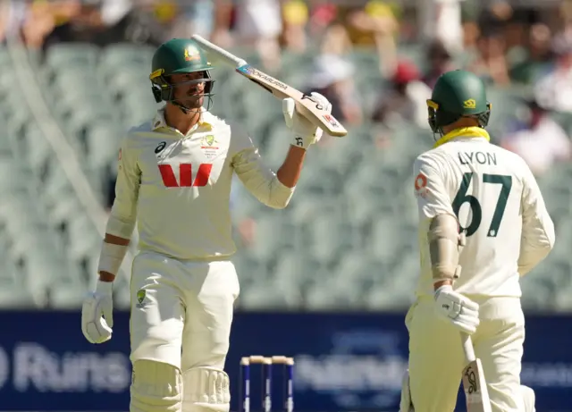 Australia's Mitchell Starc celebrates after reaching fifty runs