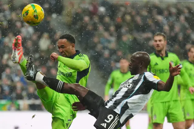 Fulham's Kenny Tete (left) and Newcastle United's Yoane Wissa battle for the ball