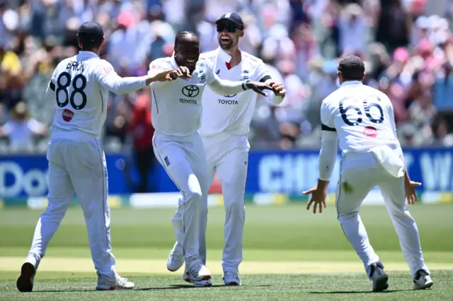 Jofra Archer of England (2-L) celebrates taking the wicket of Cameron Green of Australia during Day 1 of the Third Men's Ashes Test between Australia and England at the Adelaide Oval in Adelaide, Australia,