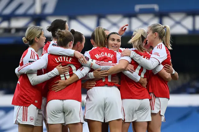 Katie McCabe of Arsenal celebrates with teammates after scoring her team's first goal during the Barclays Women's Super League match between Everton and Arsenal at Goodison Park on December 13, 2025 in Liverpool, England.