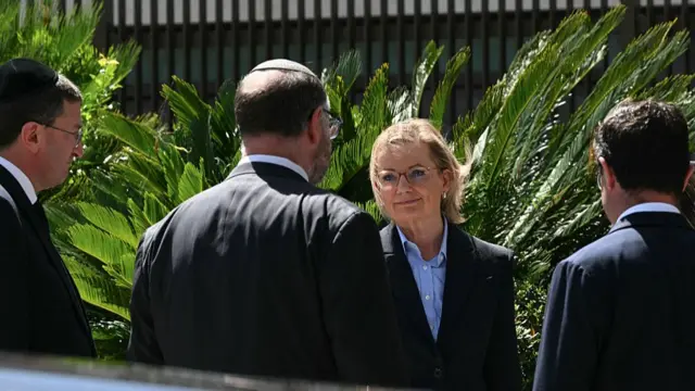 Sussan Ley arriving. She wears a blue shirt and black blazer