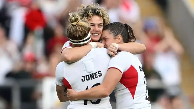 Ellie Kildunne, Zoe Harrison and Helena Rowland of England celebrate winning the World Cup