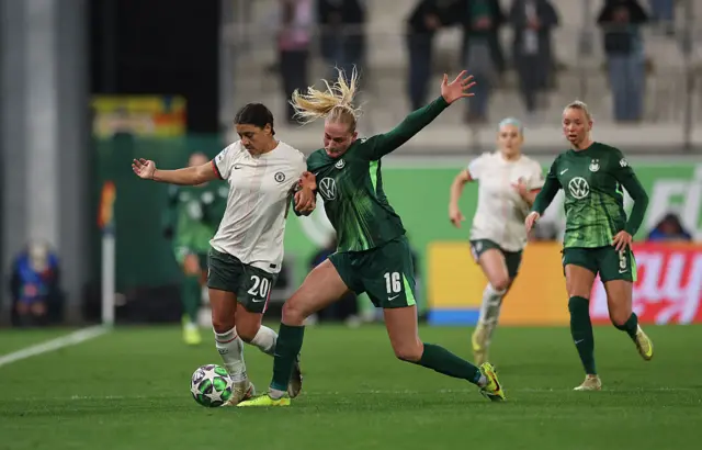 Sam Kerr of Chelsea battles for possession with Camilla Kuver of VfL Wolfsburg