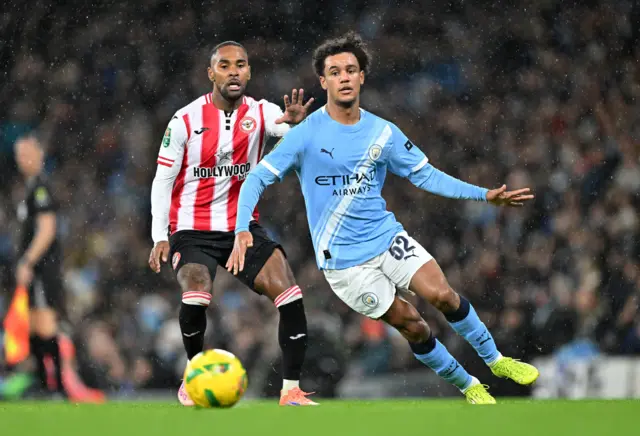 Manchester City's Oscar Bobb in action with Brentford's Rico Henry
